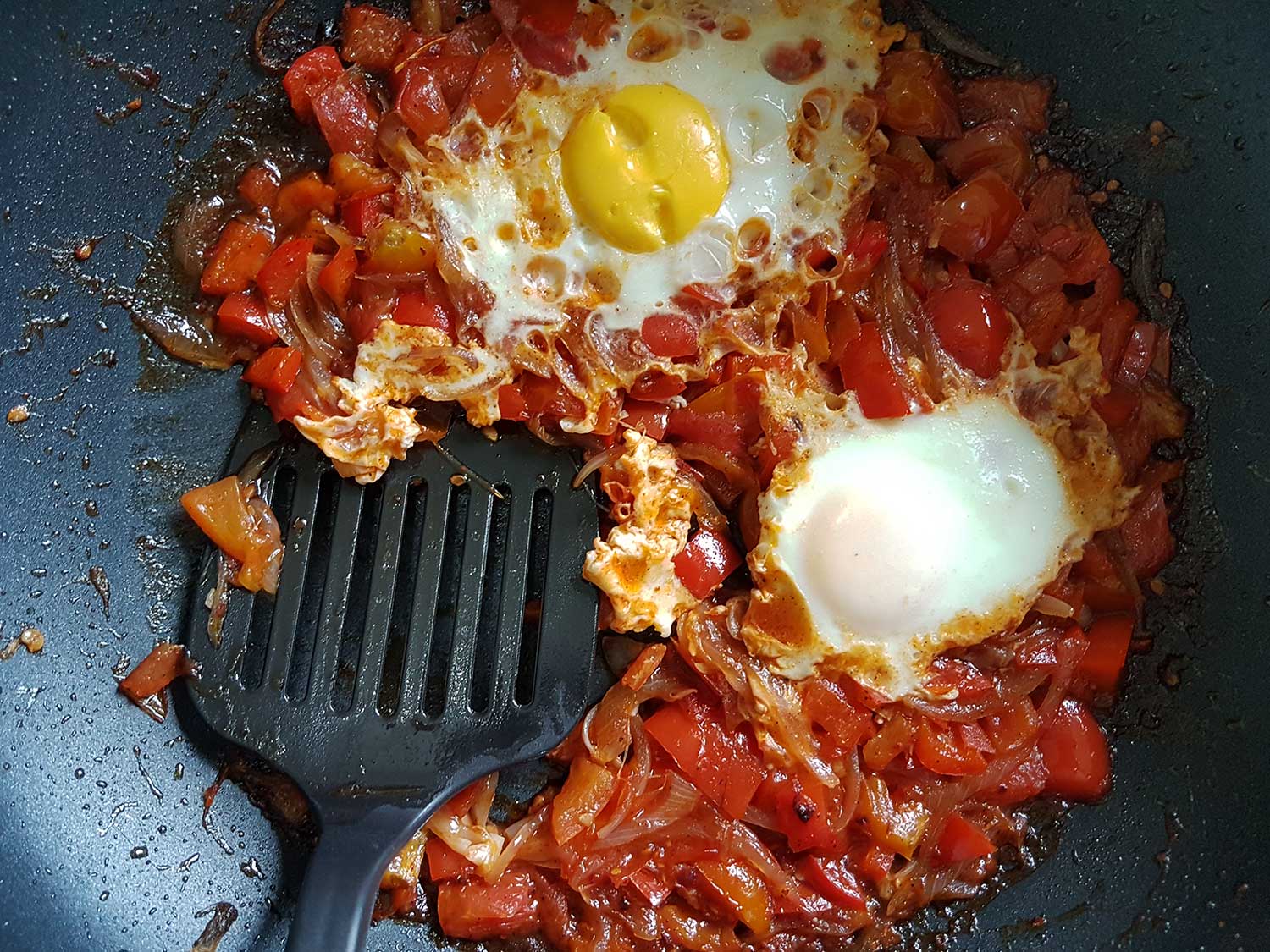 Shakshuka dish with the spoon